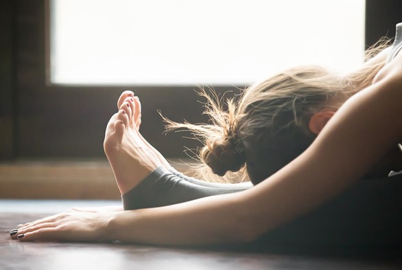 Yin Yoga: 4 Benefits of Surrendering to Your Yoga Mat
